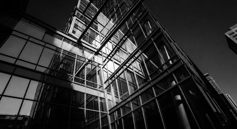 Abstract detail of a glass and steel facade in the Seaport District, severe angles in black and white
